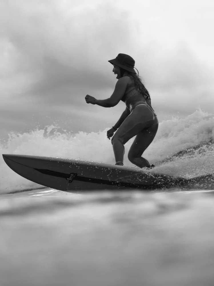 Surfer dropping into a reef break wave at Cloud 9, Siargao Island, Philippines